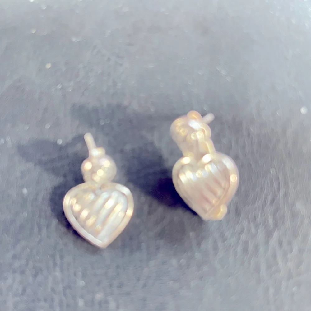 Sterling silver heart Post earrings.